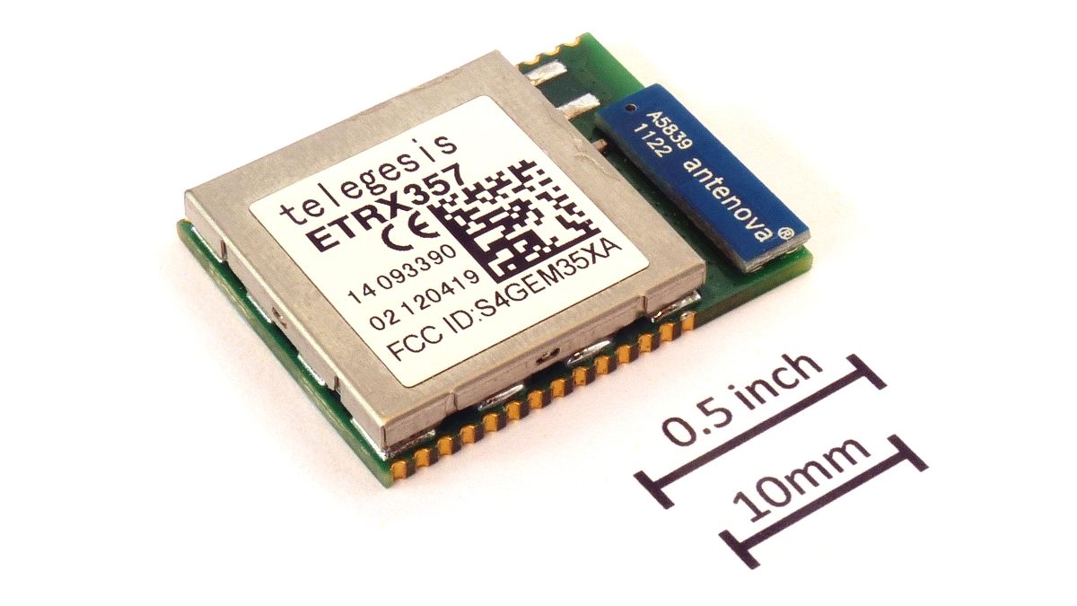 An ETRX357 Zigbee radio module next to a coin for scale.